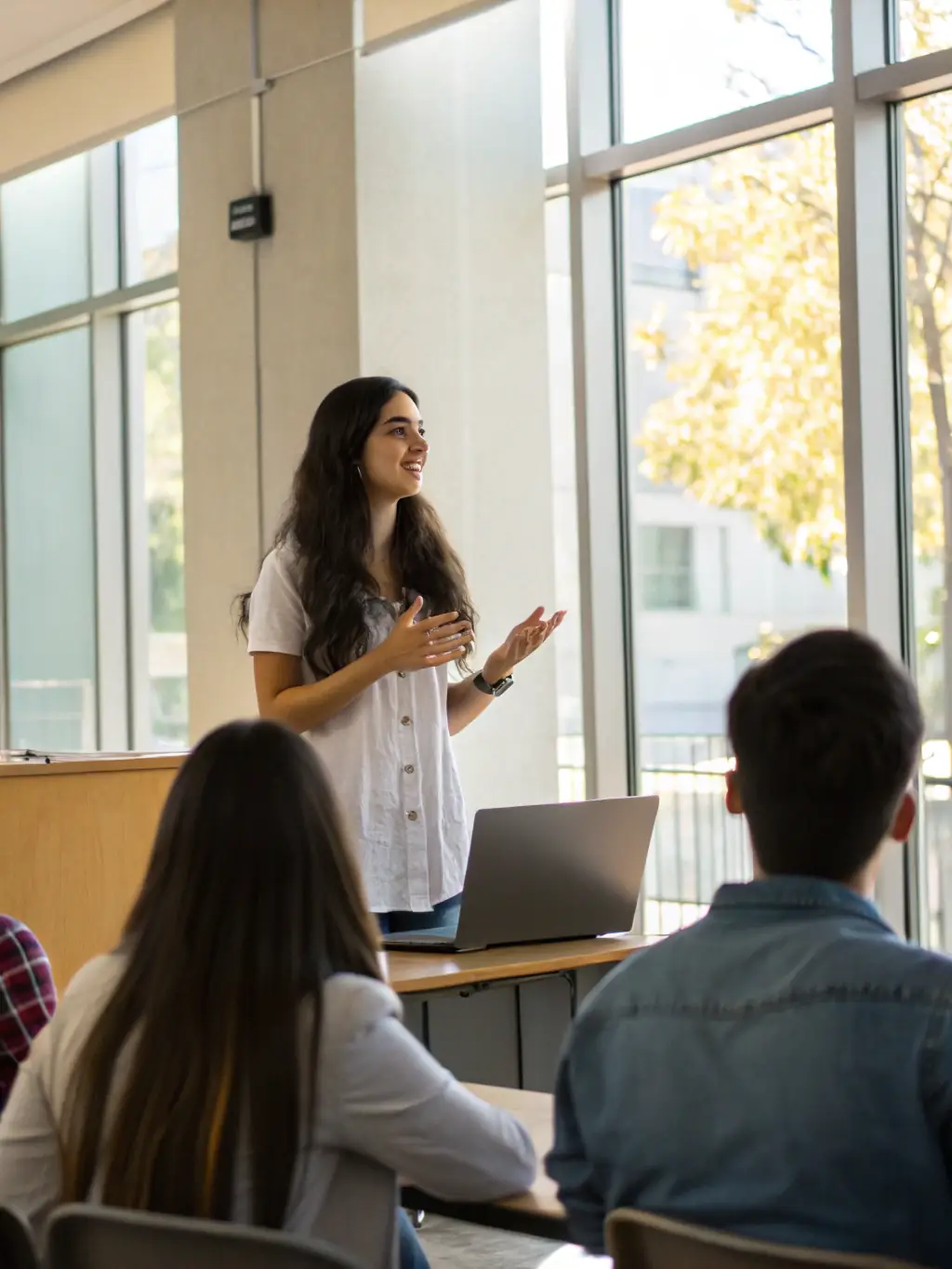 A student confidently presenting in English during a class presentation, showcasing the development of real-world communication skills through English2Imagine's methods.
