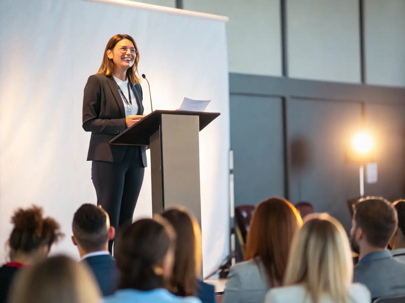 A student confidently presenting a speech in English, demonstrating the practical application of psychological techniques to overcome language barriers and enhance communication skills at English2Imagine.